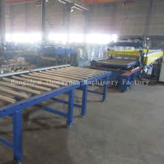 Metal deck roll forming machine with flying cutting